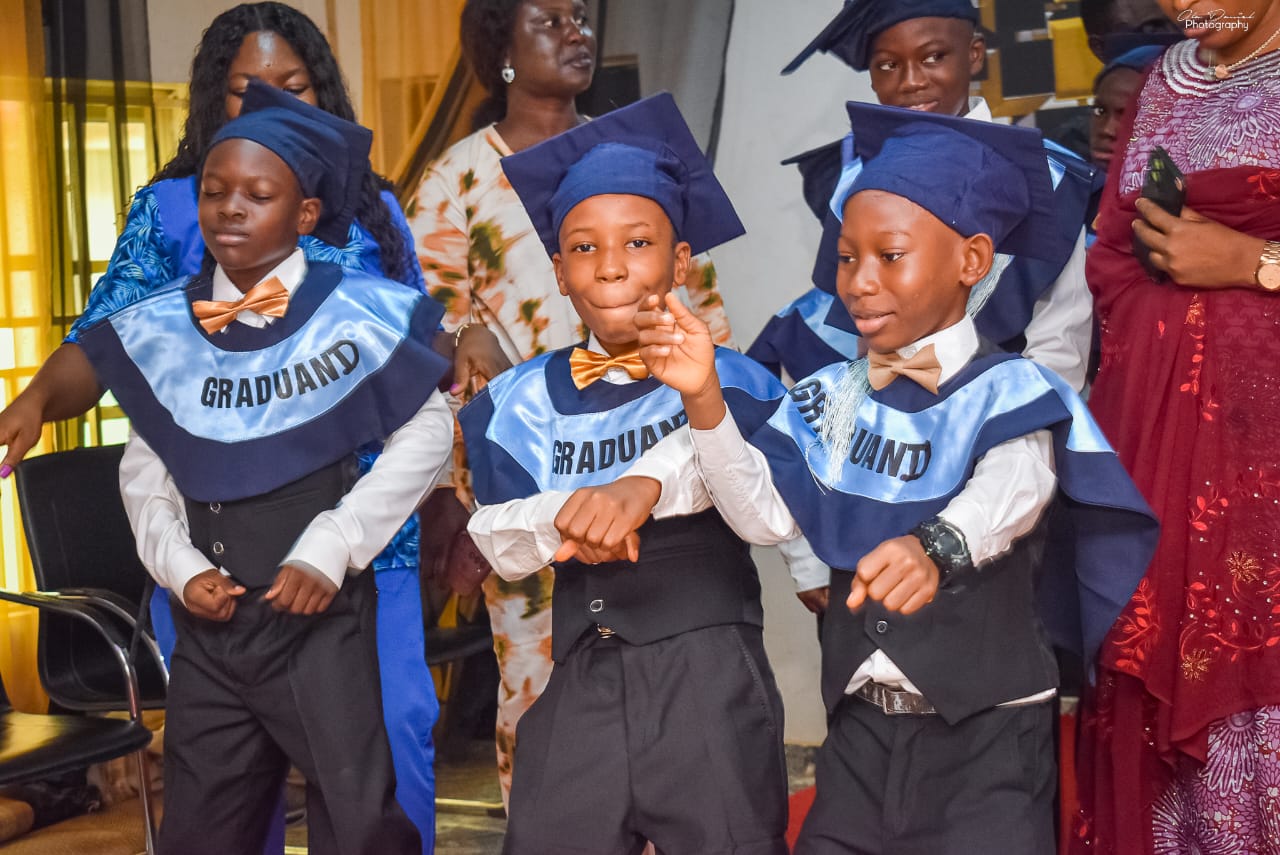 Graduands celebrating on stage