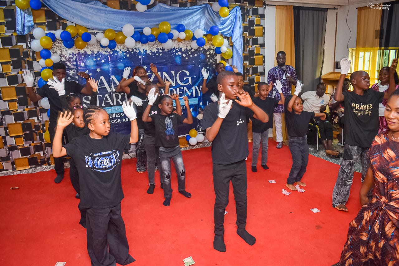 Pupils performing a choreographed routine on stage
